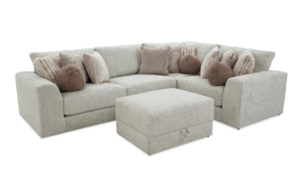 Posh Beige 134" 4-piece modular sectional in transitional style with beige polyester fabric, includes 1 armless chair, corner, left/right arm chairs, 1 storage ottoman, and 13 accent pillows.