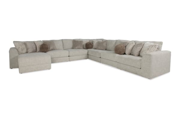 Posh Beige 172" 8-piece modular sectional with plush polyester fabric upholstery, 16 accent pillows, gel-infused memory foam, storage ottoman, and transitional style.