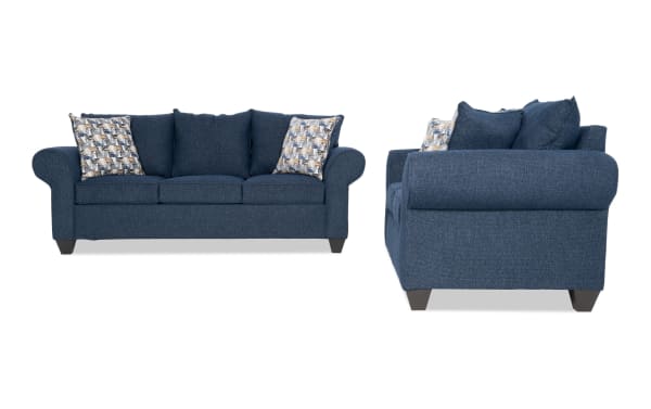 Kylie Navy 92'' Sofa and 70'' Loveseat set in transitional style with navy blue polyester fabric, roll arms, memory foam cushions, and patterned accent pillows.