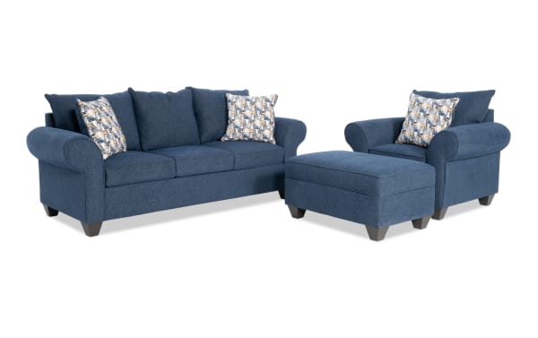 Kylie Navy 92'' transitional living room set with fabric polyester upholstery, includes sofa, chair, and storage ottoman with roll arms and accent pillows.