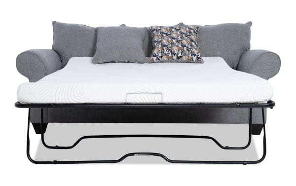 Kylie Gray 92" transitional sleeper sofa in gray polyester fabric with rolled arms, accent pillows, and pull-out queen gel memory foam mattress.