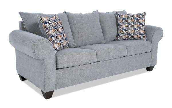 Kylie Gray 92'' Transitional Sleeper Sofa in gray polyester fabric with rolled arms, three seat cushions, patterned accent pillows, and pull-out queen gel memory foam mattress.