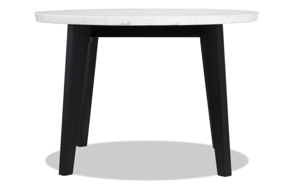 Round dining table with white marble top and black tapered legs, part of Elm 3 Piece Espresso Marble & Light Gray Upholstered Dining Set in transitional style.