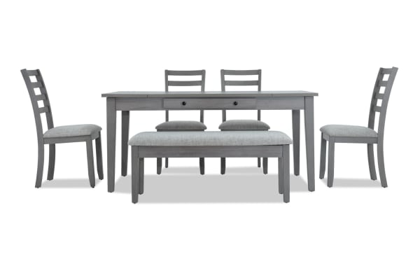 Homeworks 6 Piece Gray Dining Set with Storage Bench, featuring a transitional style gray melamine and rubberwood table with lift-top storage, felt-lined drawers, fabric-upholstered bench, and four ladder-back chairs with memory foam seats.