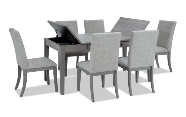 Homeworks 7 Piece Gray Upholstered Dining Set with lift-top storage table, six gray polyester fabric chairs, transitional style, durable melamine finish.