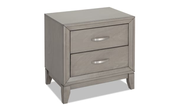 Gray Tremont transitional nightstand with two storage drawers, polyester fabric upholstery, and rubberwood solid legs, part of the 4-piece queen bedroom set.