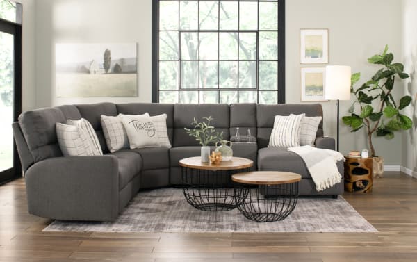 Modern Farmhouse Gray 136'' power reclining 4-piece sectional in gray polyester fabric with power headrests, USB ports, cupholders, and hidden storage.