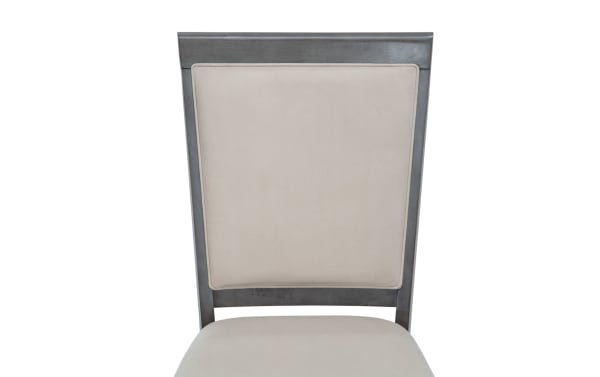Contemporary Coco II dining chair with beige polyester fabric upholstery, Asian hardwood frame, and cherry veneer accents in gray finish.