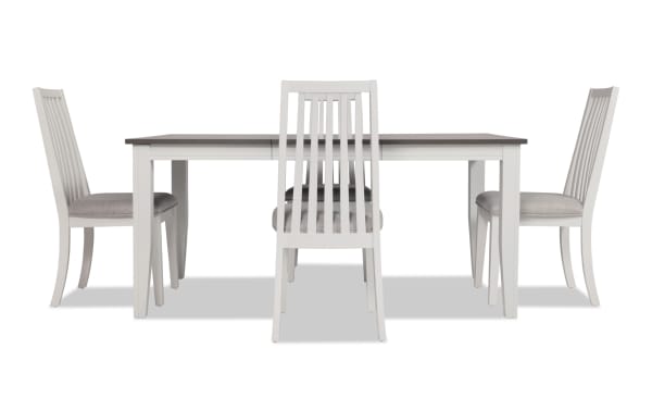 Blake 5 Piece White & Gray Upholstered Dining Set with four gray fabric polyester cushioned slat-back chairs and extendable white and gray MDF and hardwood table in transitional style.