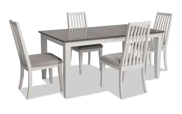 Blake 5 Piece White & Gray Upholstered Dining Set with four gray fabric polyester cushioned chairs, white and gray extendable MDF and hardwood table, transitional style.