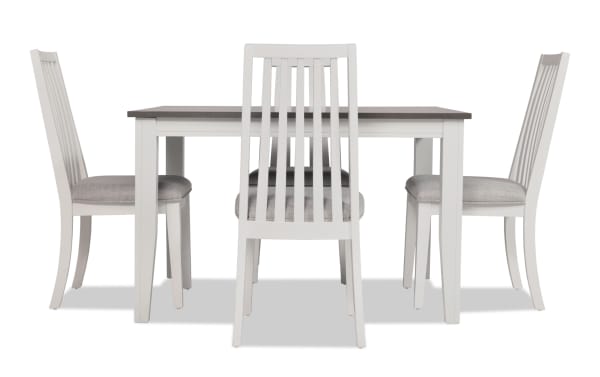Blake 5 Piece White & Gray Upholstered Dining Set with four gray fabric cushioned slat-back chairs and extendable white and gray wood table in transitional style.