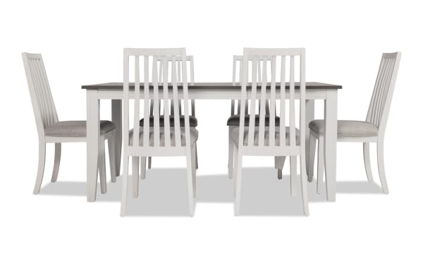 Blake 7 Piece White & Gray Upholstered Dining Set with six gray fabric polyester cushioned slat-back chairs and white-gray extendable MDF and hardwood table.