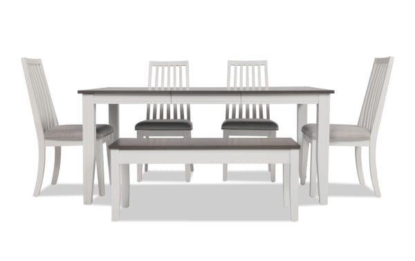 Blake 6 Piece White & Gray Upholstered Dining Set with Storage Bench featuring a transitional style, gray fabric polyester cushioned chairs, extendable MDF and hardwood table, and a matching storage bench.