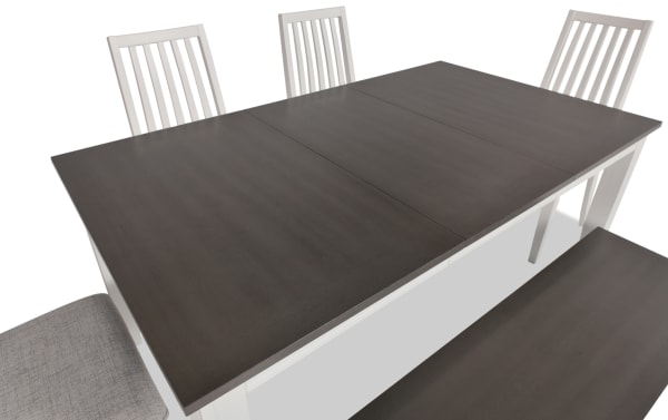 Blake 6 Piece Transitional Dining Set with gray polyester upholstered slat-back chairs, extendable white and gray MDF table, and storage bench.