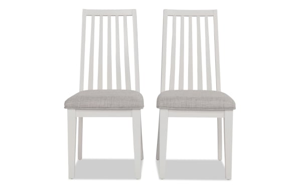 Set of 2 Blake White & Gray Windsor transitional dining chairs with gray polyester upholstered seats, hardwood and rubberwood slat backs.