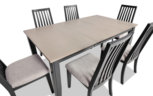 Blake 7 Piece Graphite & Gray Upholstered Dining Set with six cushioned slat-back chairs and extendable MDF and hardwood table in transitional style.