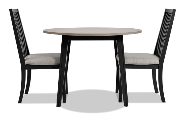 Blake 3 Piece Graphite & Gray Upholstered Dining Set with two gray polyester fabric cushioned slat-back chairs and a round drop leaf table in transitional style.