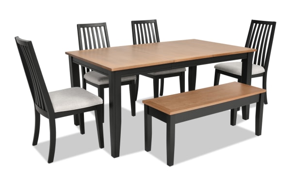Blake 6 Piece Black & Natural Upholstered Dining Set with four gray fabric polyester chairs, storage bench, and extendable wood table in transitional farmhouse style.