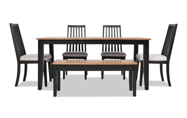 Blake 6 Piece Black & Natural Upholstered Dining Set with four gray polyester fabric slat-back chairs, storage bench, and extendable wood table in transitional farmhouse style.