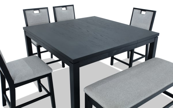 Brookline 6 Piece Black & White Upholstered Counter Height Square Dining Set with storage bench, featuring white polyester fabric cushions, solid wood frame, and transitional style.
