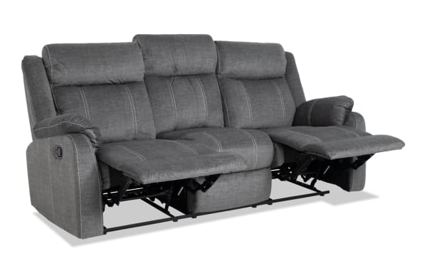 Lagoon Gray 81'' manual reclining sofa in transitional style, featuring soft polyester fabric upholstery and dual recliner seats for adjustable comfort.