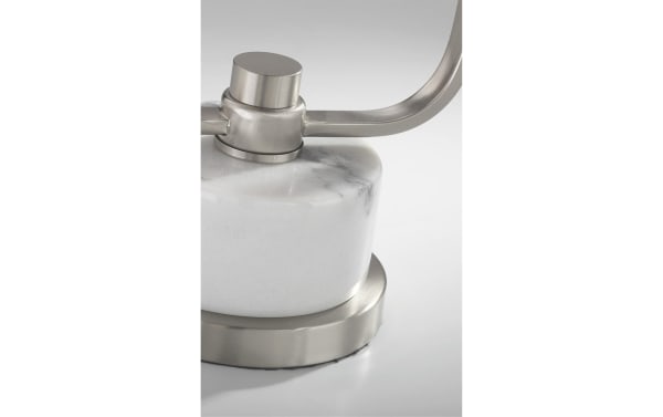 Close-up of Liam transitional table lamp base with brushed nickel hardware and smooth white marble, highlighting modern metal and stone design.