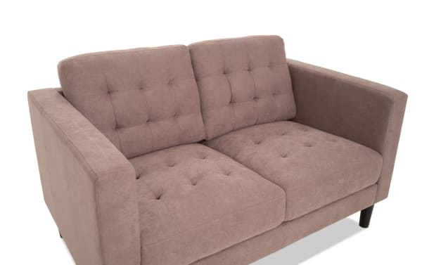 Metro Taupe 57'' Loveseat in beige taupe polyester fabric with tufted cushions, track arms, and transitional style from the Metro collection.