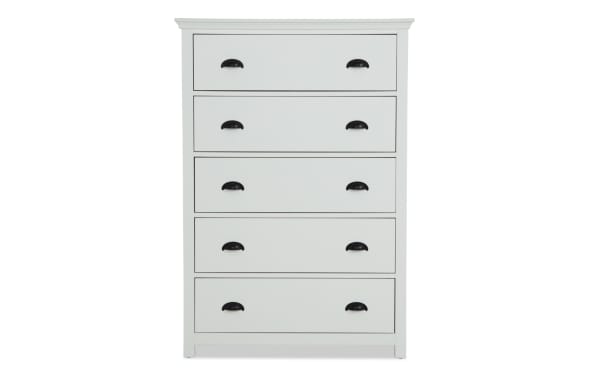 Newport White 5 Drawer Chest in transitional style, made of MDF, rubberwood solids, and particle board, with black cup handles for organized bedroom storage.