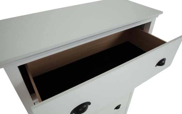 Newport White 5 Drawer Chest in transitional style with MDF, rubberwood solids, and particle board, featuring spacious white drawers with black cup handles.