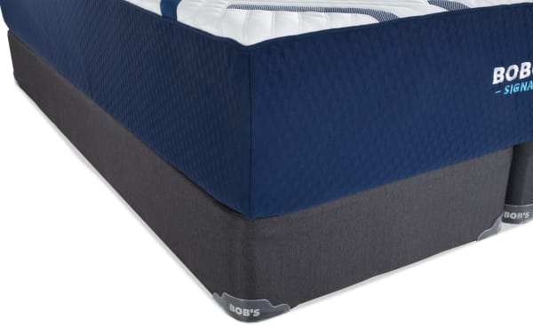 Signature Gel 13.5'' Queen Firm Split Standard Mattress Set by Bob's, featuring a navy blue quilted gel memory foam mattress with a dark gray fabric foundation.