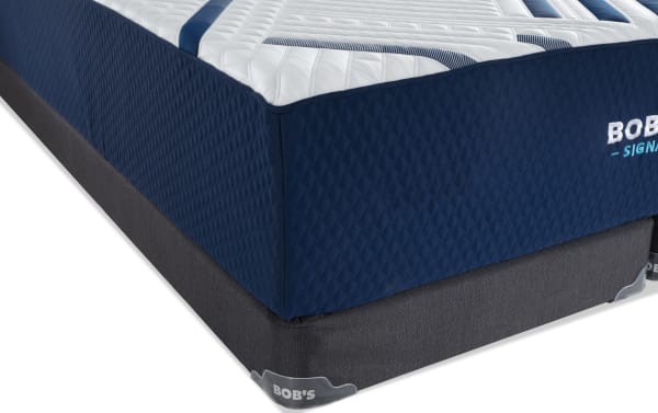 Signature Gel 13.5'' King Firm Split Low Profile Mattress Set by Bob's, featuring a navy quilted fabric cover with white and blue accents and a dark gray foundation base.