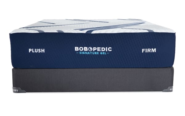 Bob-O-Pedic Signature Gel 13.5'' Queen Dual Standard Mattress Set with plush and firm comfort sides, blue and white quilted cover, and gray foundation.
