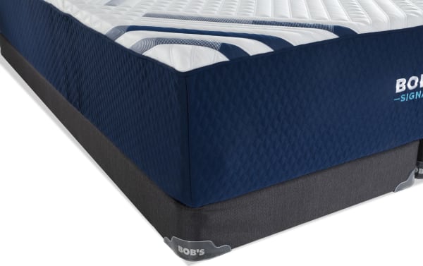Signature Hybrid 13.5'' Twin XL Firm Low Profile Mattress Set from Bob-O-Pedic Signature collection, featuring a navy quilted cover with white and blue striped top, and a dark gray mattress foundation.