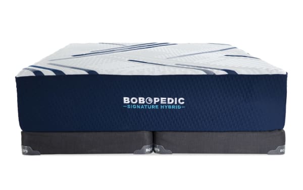 Bob-O-Pedic Signature Hybrid 13.5'' King Firm Split Low Profile Mattress Set with navy blue quilted sides, white top with blue stripes, and dark gray foundation.