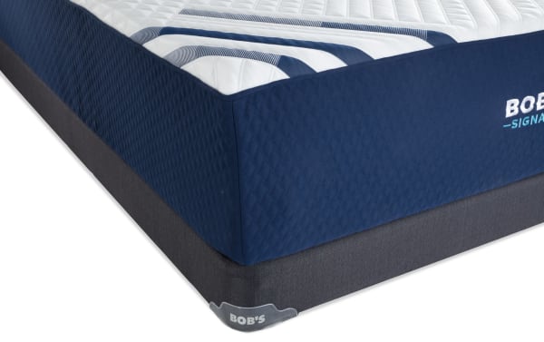 Signature Hybrid 13.5'' Queen Plush Low Profile Mattress Set by Bob's, featuring a navy blue quilted cover with white and blue top design and a dark gray foundation.