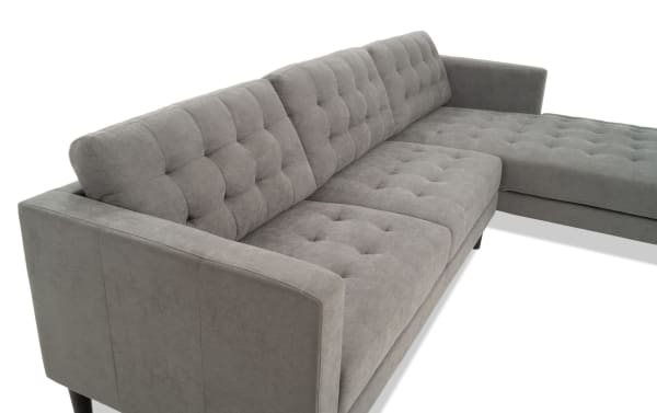 Metro Charcoal 112'' 2 Piece Right Arm Facing Chaise Sectional in gray polyester fabric with tufted cushions, track arms, and transitional style.