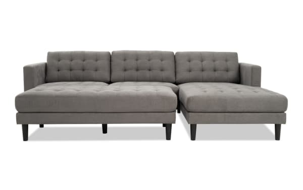 Metro Charcoal 112'' 2 Piece Right Arm Facing Chaise Sectional with Ottoman in gray polyester fabric, tufted cushions, track arms, and transitional style.