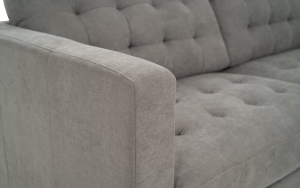 Charcoal gray Metro sectional sofa armrest with tufted polyester fabric upholstery, transitional style, and clean track arm design.