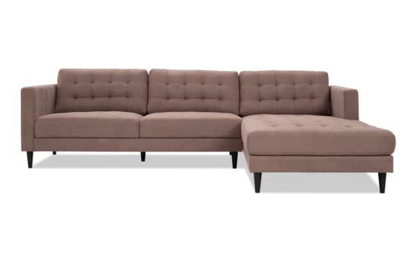 Metro Taupe 112'' 2-piece right arm facing chaise sectional in beige polyester fabric with tufted cushions, track arms, and tapered legs.
