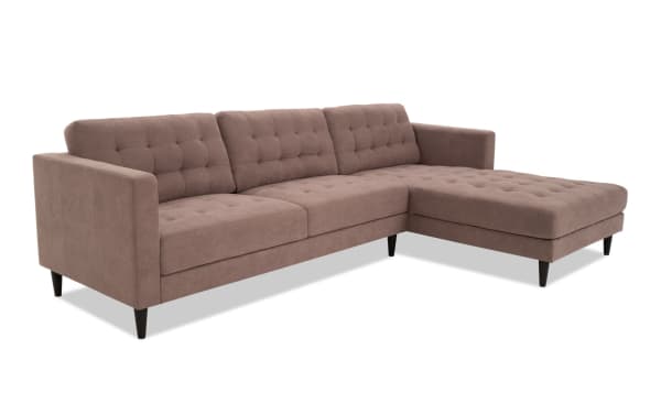 Metro Taupe 112'' 2 Piece Right Arm Facing Chaise Sectional with tufted polyester fabric upholstery, track arms, and tapered black legs in a transitional beige taupe color.