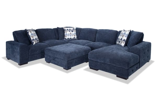 Contemporary Playground Navy 145'' 4-piece right arm facing sectional with plush polyester fabric, memory foam cushions, storage chaise, and pop-up sleeper loveseat.