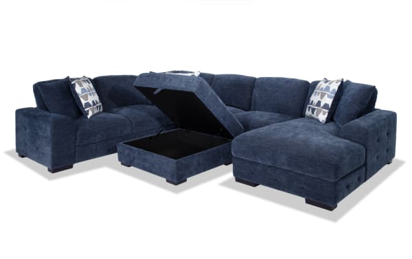 Contemporary Playground navy blue 4-piece right arm facing sectional with pop-up sleeper loveseat, storage ottoman, polyester fabric, and tufted details.