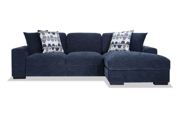 Contemporary Playground Navy 116'' 2-piece right arm facing pop-up sleeper chaise sectional with navy polyester fabric, memory foam cushions, tufted detailing, and storage chaise.