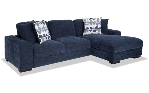 Playground Navy 116'' 2 Piece Right Arm Facing Pop-Up Sleeper Chaise Sectional in navy blue polyester fabric with deep cushions, hand-tufted detailing, oversized accent pillows, and hidden chaise storage. Contemporary style fabric sectional with memory foam seating and pop-up sleeper loveseat.