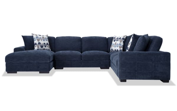 Contemporary Playground Navy 145'' 4-piece left arm facing pop-up sleeper chaise sectional in plush polyester fabric with memory foam cushions, tufted detailing, and storage chaise.
