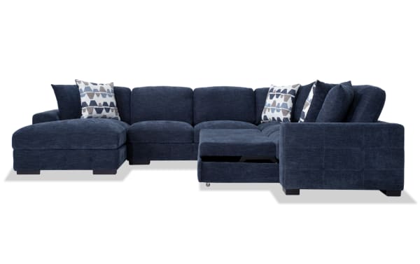 Playground Navy 145'' 4 Piece Left Arm Facing Pop-Up Sleeper Chaise Sectional in contemporary blue polyester fabric with memory foam cushions, oversized accent pillows, hand-tufted details, storage chaise, and sleeper loveseat functionality.