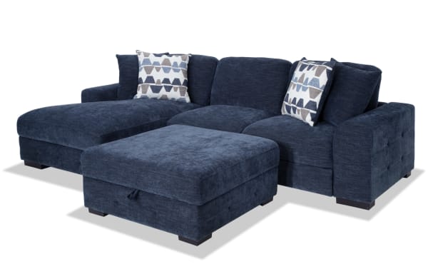 Playground Navy 116" 2-piece left arm facing pop-up sleeper chaise sectional with storage ottoman, navy polyester fabric, contemporary style, tufted detailing, and oversized accent pillows.
