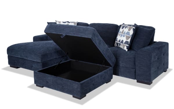 Playground Navy 116" 2-piece left arm facing sectional with navy polyester fabric, pop-up sleeper loveseat, storage chaise, and ottoman.