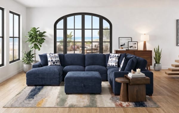 Contemporary Playground Navy 145" 4-piece left arm facing chaise sectional with plush polyester fabric, memory foam cushions, hand-tufted detailing, pop-up sleeper loveseat, and storage ottoman.