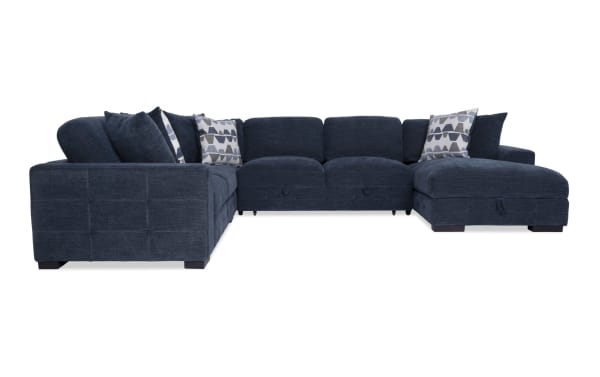 Contemporary Playground navy blue 4-piece fabric sectional with right arm chaise, pop-up sleeper, memory foam cushions, tufted polyester upholstery, and storage.